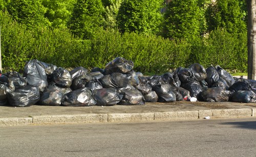 Waste collection vehicle in an urban Rickmansworth setting